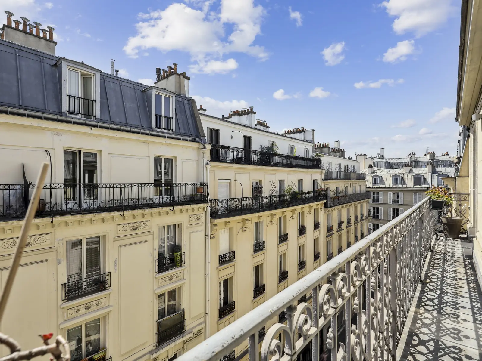Running Paris balcony overlooking the street