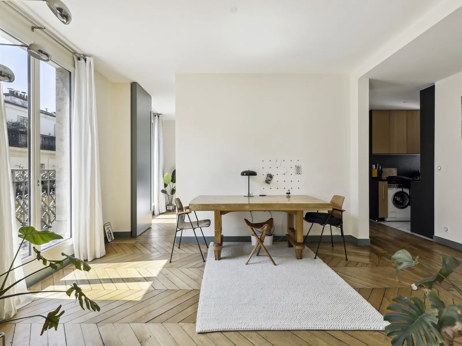 Paris living room with a wooden table and parquet